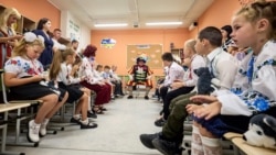 UKRAINE -- Children mark the start of the new school year, known as the 'Day of Knowledge,' at an underground school in Kharkiv, Ukraine, 02 September 2024