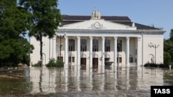 Floodwaters leave a building in Russian-occupied Nova Kakhovka, Ukraine, partially submerged after the breach of the Kakhovka Dam on June 6, 2023.