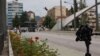 A camera stand sits atop a bridge on the Ibar River, which separates heavily Albanian South Mitrovica from the smaller and mostly Serb North.