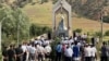 People in Kyrgyzstan's Jalal-Abad region attend a commemoration on June 13 for victims of ethnic clashes in 2010.
