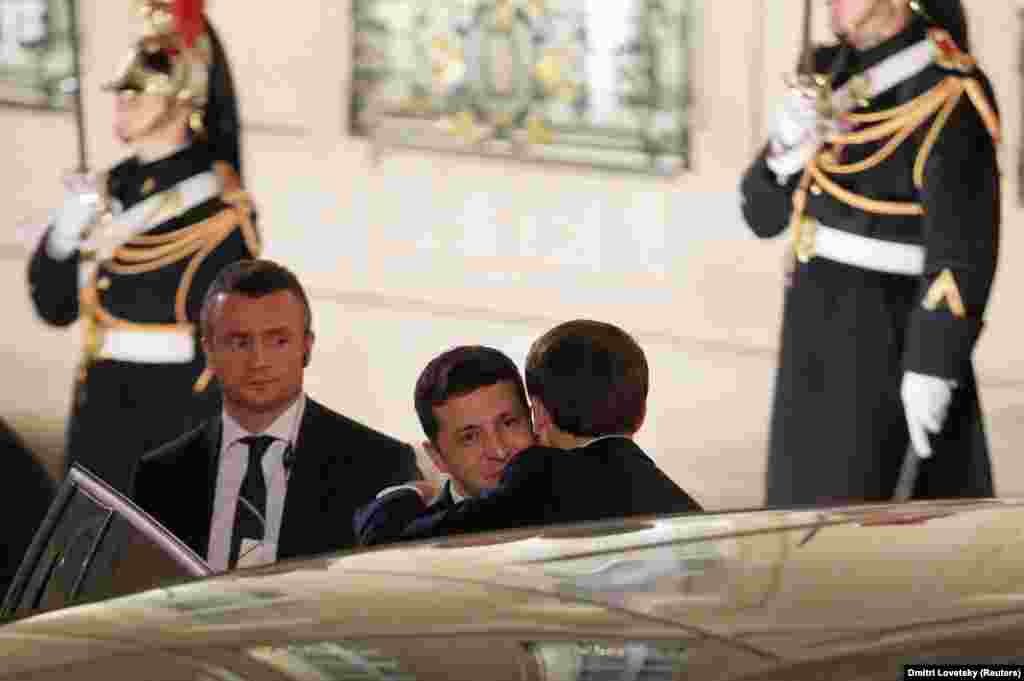 Macron embraces Zelenskiy after the summit in Paris. The meeting marked a tentative restart of high-level political communication between Kyiv and Moscow and a renewed commitment to the Minsk agreements, a series of measures aimed at achieving a lasting cease-fire. Despite the promising steps, the summit did not result in a major breakthrough.