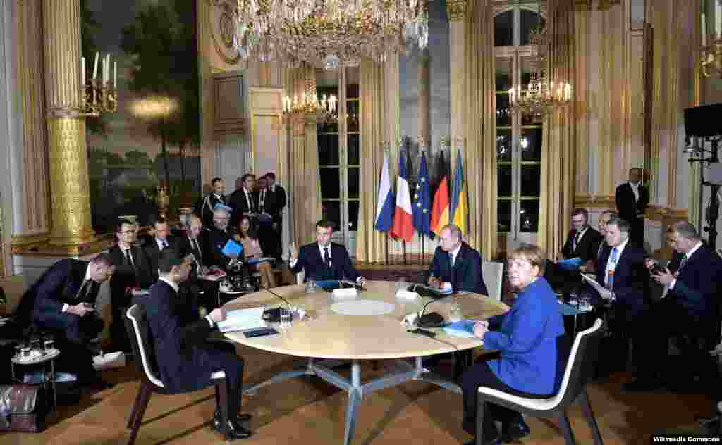 After Russia was excluded from the 75th anniversary D-Day commemorations, the leaders of Ukraine, Russia, France, and Germany met at the Normandy Format meeting in Paris on December 9, 2019, in a significant diplomatic effort aimed at addressing the conflict in eastern Ukraine. The participants -- Ukrainian President Volodymyr Zelenskiy, French President Emmanuel Macron, Russian President Vladimir Putin, and German Chancellor Angela Merkel -- met in hopes of achieving a lasting cease-fire in eastern Ukraine, parts of which had been under the control of Russia-backed separatists since 2014.