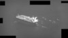 A U.S. Navy video shows fast-attack craft from Iran's Islamic Revolutionary Guards Corps swarming an oil tanker as it transits the Strait of Hormuz on May 3.