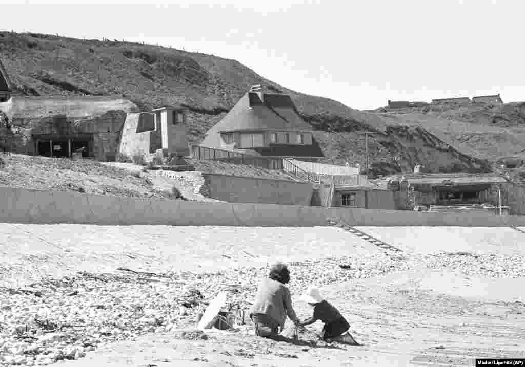 French children play on the beach in Vierville-dur-Mer -- known as Omaha Beach -- where German bunkers still stand on June 6, 1964, 20 years after the D-Day landings. Throughout his 11 years as president of France, Charles de Gaulle declined to take part in D-Day events. “He refused to commemorate June 6, given the way he had been treated at the time of the D-Day landings. He hadn't been involved in the discussions or in the implementation of the plan,” says historian Denis Peschanski. De Gaulle also did not invite world leaders to the 25th anniversary in 1969.