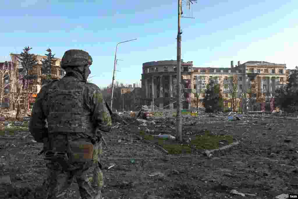A pro-Russian soldier in Bakhmut&rsquo;s central square. The photo was made in front of the city&rsquo;s administration building (out of frame on left) during an April 10 visit by Denis Pushilin, the Russian-installed leader of Ukraine&#39;s Donetsk region. Yevgeny Prigozhin, the head of Russia&rsquo;s Wagner mercenary group, claimed on April 11 that his forces controlled more than 80 percent of the city. Ukrainian officials have denied the assertion.