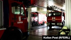 Firetrucks at the main Kharkiv station as an air alert sounds outside