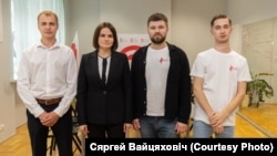 Belarusian labor organizer Syarhey Vaytsyakhovich (right) poses for a photo with opposition leader Svyatlana Tsikhanouskaya (second from left).