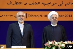 Iranian President Hassan Rohani (right) and Foreign Minister Mohammad Javad Zarif in Tehran in December 2014