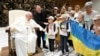 Pope Francis meets Ukrainian refugees as he holds his weekly general audience at the Vatican on August 24, 2022.