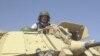 RFE/RL's Ron Synovitz in an APC in Iraq, March 2003