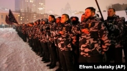 Volunteers of the right-wing paramilitary Azov Civil Corps swear an oath of allegiance in central Kyiv on January 28.