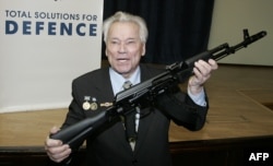 Mikhail Kalashnikov with one of his fabled assault rifles in 2006.