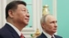 Президент России Владимир Путин (справа) и лидер Китая Си Цзиньпин на встрече в Москве в мае.
