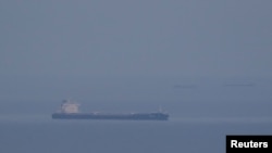Ships carrying Ukrainian grain are seen in the Black Sea near the Ukrainian port of Odesa.