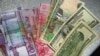 Türkmenistanyň şäherlerinde walýuta söwdagärlerine garşy reýd geçirilýär