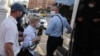 RFE/RL correspondent Alyaksandra Dynko was detained while covering a picket in Minsk on June 19.