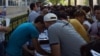 Many Uzbeks have had to queue for long periods as they scramble to get new mobile phone numbers following the suspension of MTS's operating license. 